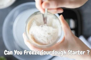 Active sourdough starter bubbling in a glass jar