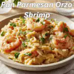 One Pan Parmesan Orzo with Shrimp with vibrant garnish