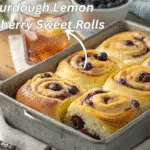 These Sourdough Lemon Blueberry Sweet Rolls Are Summer in a Pan 6 Freshly baked sourdough lemon blueberry sweet rolls in a rustic kitchen