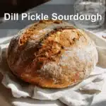 Dill Pickle Sourdough Loaf on a white napkin with natural light