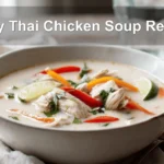 Easy Thai Chicken Soup Recipe creamy coconut broth with chicken pieces colourful peppers and lime