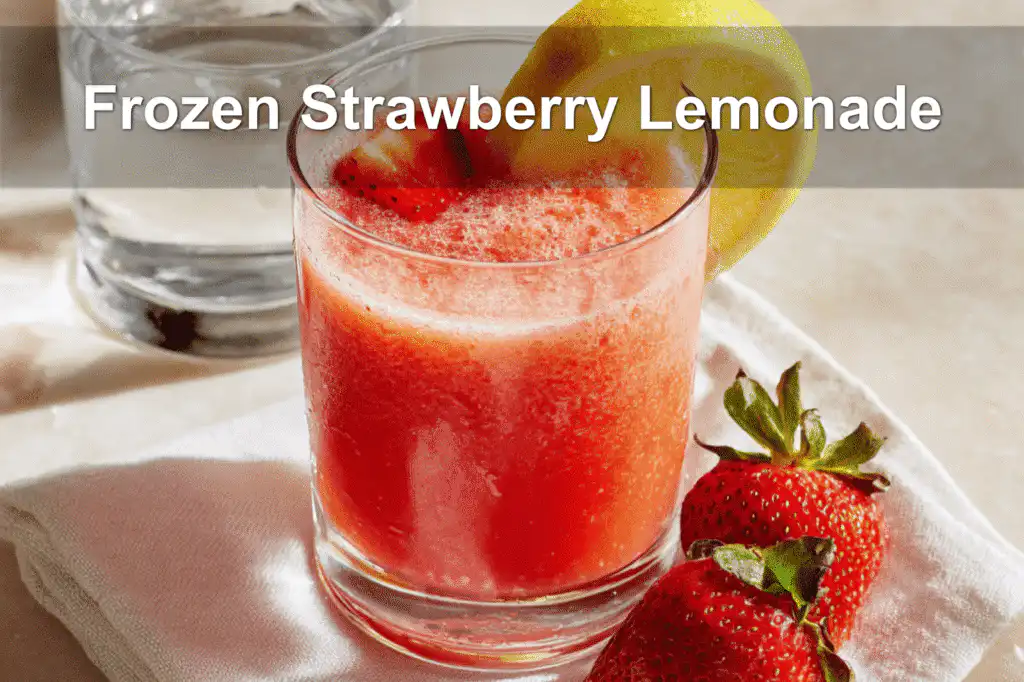 Refreshing frozen strawberry lemonade in a tall glass with garnish on a white napkin.