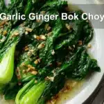 Garlic Ginger Bok Choy plated with vibrant greens, warm tones, and soft natural lighting.