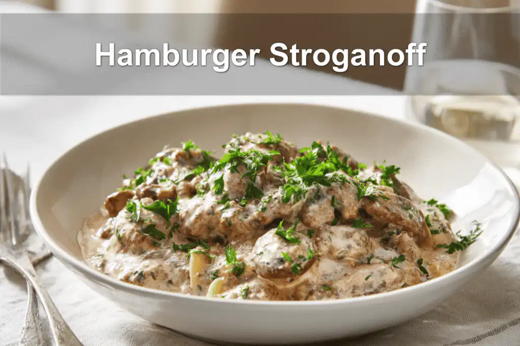 Creamy Hamburger Stroganoff served in a white bowl with a minimal and inviting setup.