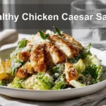 Healthy Chicken Caesar Salad with breaded chicken pieces panko crumbs romaine lettuce and spicy honey drizzle