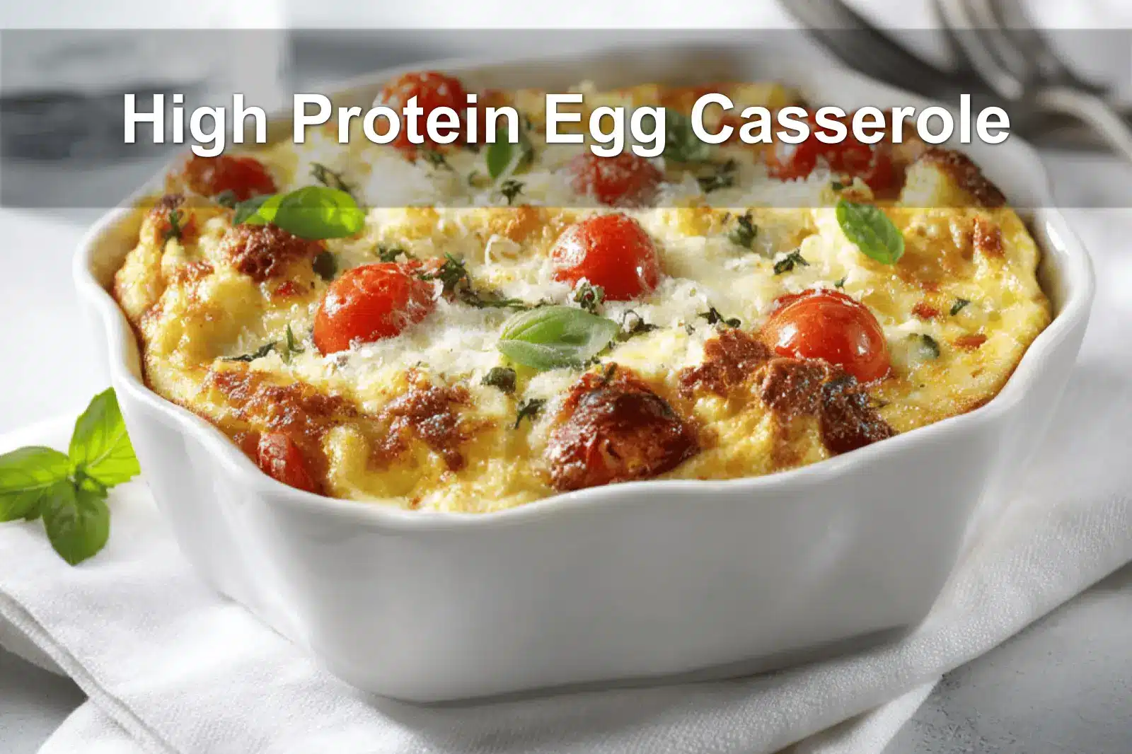 High Protein Egg Casserole golden baked with cherry tomatoes and basil in warm natural light