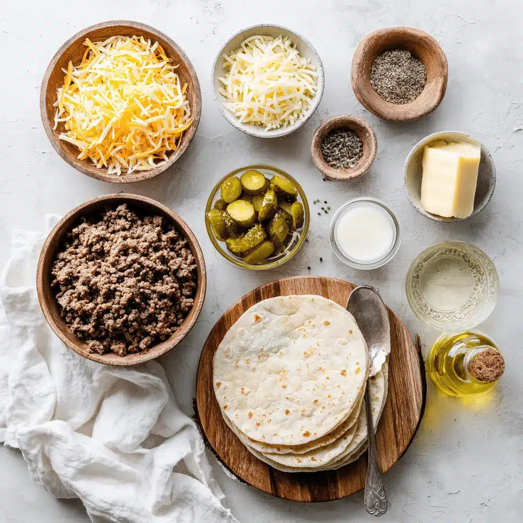 Garlic Butter Beef Cheeseburger Rollups: Easy and Irresistible 4 Garlic Butter Beef Cheeseburger Rollups on white napkin with melted cheese and pickles