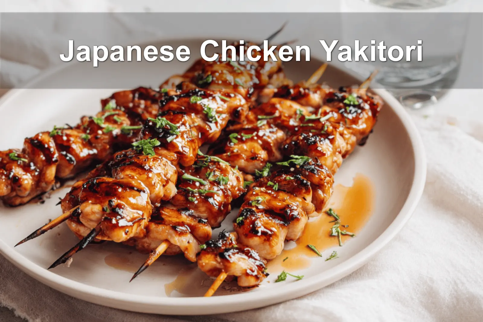 Japanese Chicken Yakitori skewers on a white napkin with rich glaze and natural lighting.