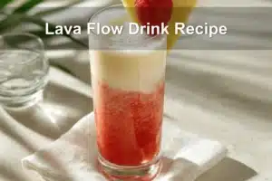 Tropical Lava Flow Drink Recipe styled on white napkin with fresh garnishes and vibrant hues.