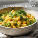 Lemon Herb Quinoa with Chickpeas beautifully presented on a white napkin with a glass of water