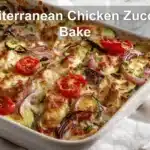 Mediterranean Chicken Zucchini Bake golden melted cheese zucchini cherry tomatoes herbs on cloth