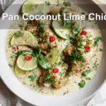 One Pan Coconut Lime Chicken plated with fresh garnishes and a creamy sauce