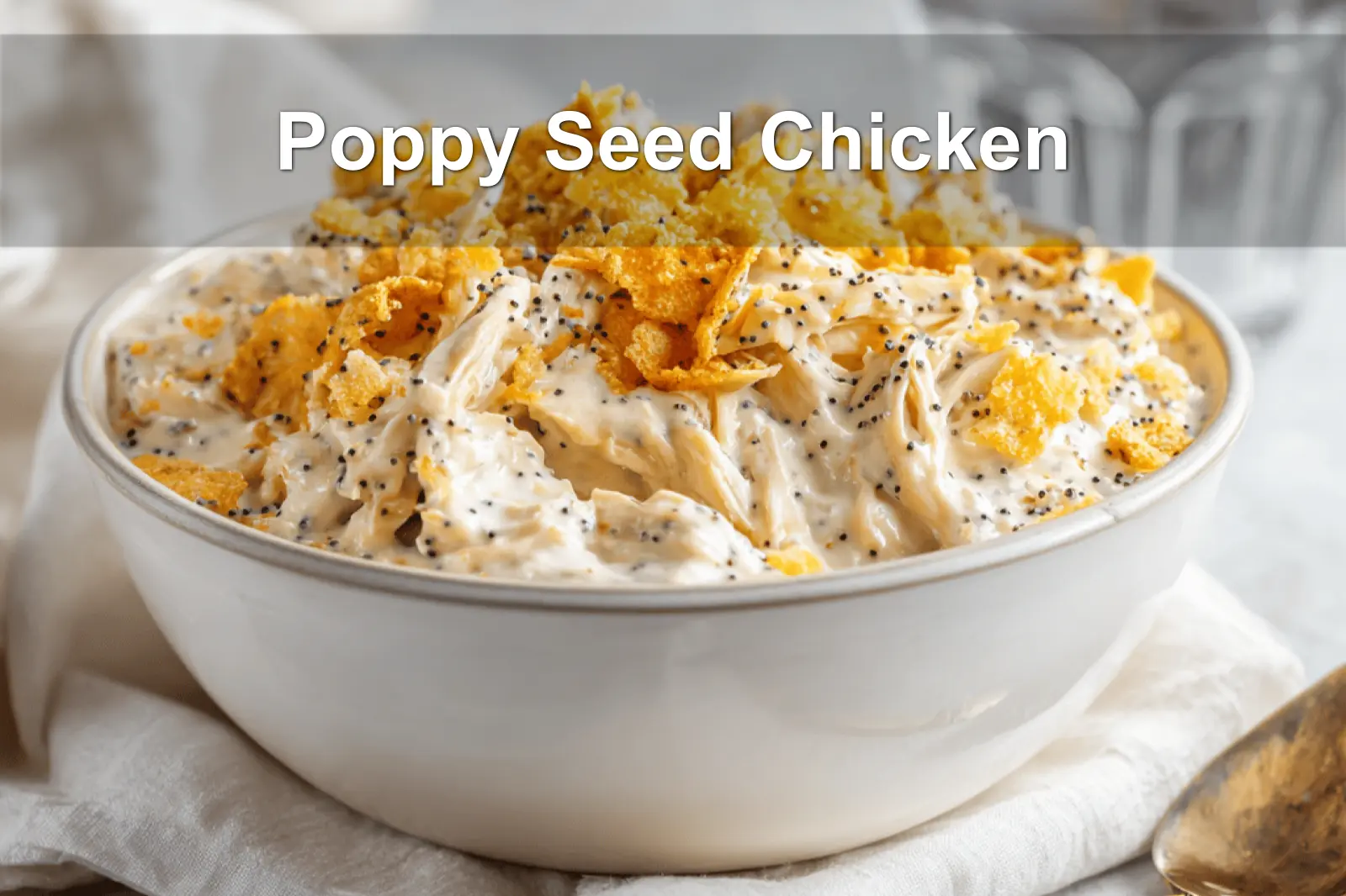 Poppy Seed Chicken casserole served with creamy sauce and crushed crackers on a clean table.
