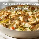 Quick Rotisserie Chicken Zucchini Casserole warm bake on white cloth beside glass of water