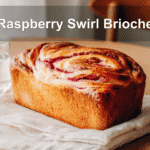 Golden Raspberry Swirl Brioche loaf with vibrant raspberry swirls