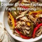 Slow Cooker Chicken Fajitas with Fajita Seasoning served with peppers onions tortillas and fresh limes