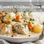 Slow Cooker Chicken Stew Recipe warm bowl on white cloth napkin with glass of water