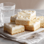 Final Sourdough Sugar Cookie Bars plated on white napkin with natural lighting and clean styling