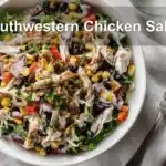 Southwestern Chicken Salad with vibrant ingredients and creamy Greek yogurt dressing displayed with warm tones.