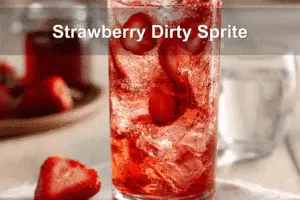 Strawberry Dirty Sprite in a clear glass with ice, fresh strawberries, and a vibrant summer vibe