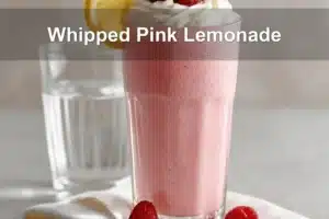 Whipped Pink Lemonade served with cream and raspberries to beat the heat
