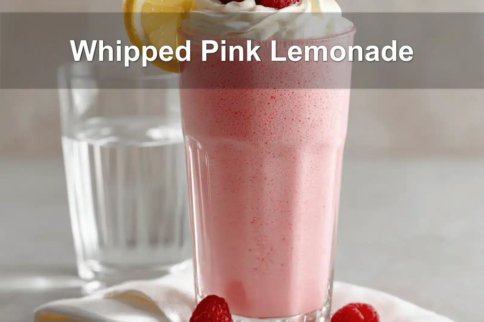 Whipped Pink Lemonade served with cream and raspberries to beat the heat