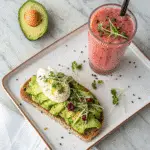 Healthy breakfast plate with sourdough toast and pink salt drink