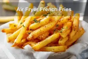 Crispy Air Fryer French Fries on white napkin with clear water glass and warm tones