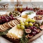 Artisan Charcuterie Board Recipe featuring meats cheeses fruits nuts figs olives crackers and honey