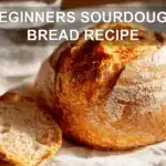 BEGINNERS SOURDOUGH BREAD RECIPE warm crusted scored loaf on white cloth with water