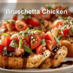 BRUSCHETTA CHICKEN topped with tomatoes basil garlic and balsamic glaze in warm light