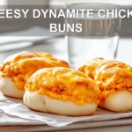 CHEESY DYNAMITE CHICKEN BUNS golden baked buns with melted cheese and spicy filling