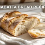 CIABATTA BREAD RECIPE artisan loaves on white napkin warm natural light appetizing close up