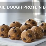 COOKIE DOUGH PROTEIN BALLS single bowl on white cloth warm natural light shallow depth of field