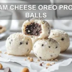 CREAM CHEESE OREO PROTEIN BALLS close up on white napkin warm natural light