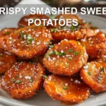 CRISPY SMASHED SWEET POTATOES plated with honey drizzle and chili sauce warm golden crunch