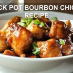 CROCK POT BOURBON CHICKEN RECIPE glazed chicken in bowl on white napkin with clear water