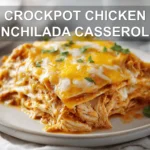 CROCKPOT CHICKEN ENCHILADA CASSEROLE cheesy golden baked casserole in white dish with glass of water