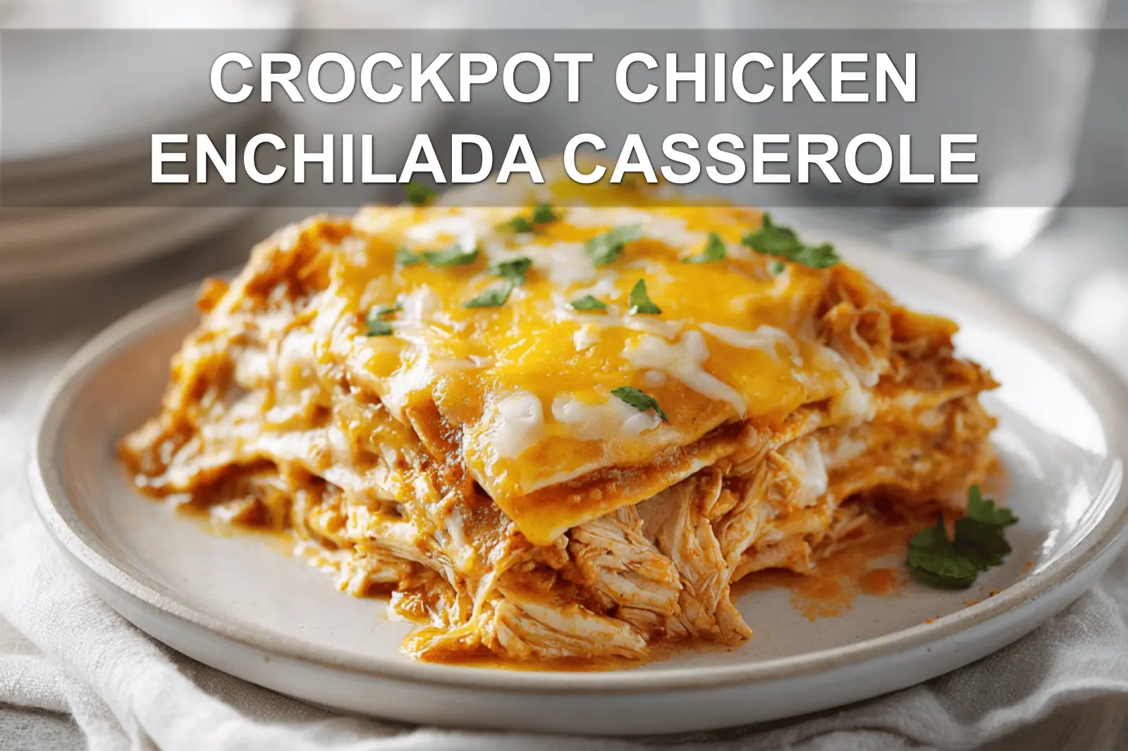 CROCKPOT CHICKEN ENCHILADA CASSEROLE cheesy golden baked casserole in white dish with glass of water