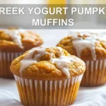 GREEK YOGURT PUMPKIN MUFFINS warm homemade muffins on white napkin with glass of water