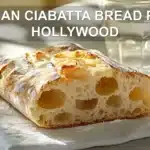 ITALIAN CIABATTA BREAD PAUL HOLLYWOOD rustic torn loaf on white napkin with glass of water