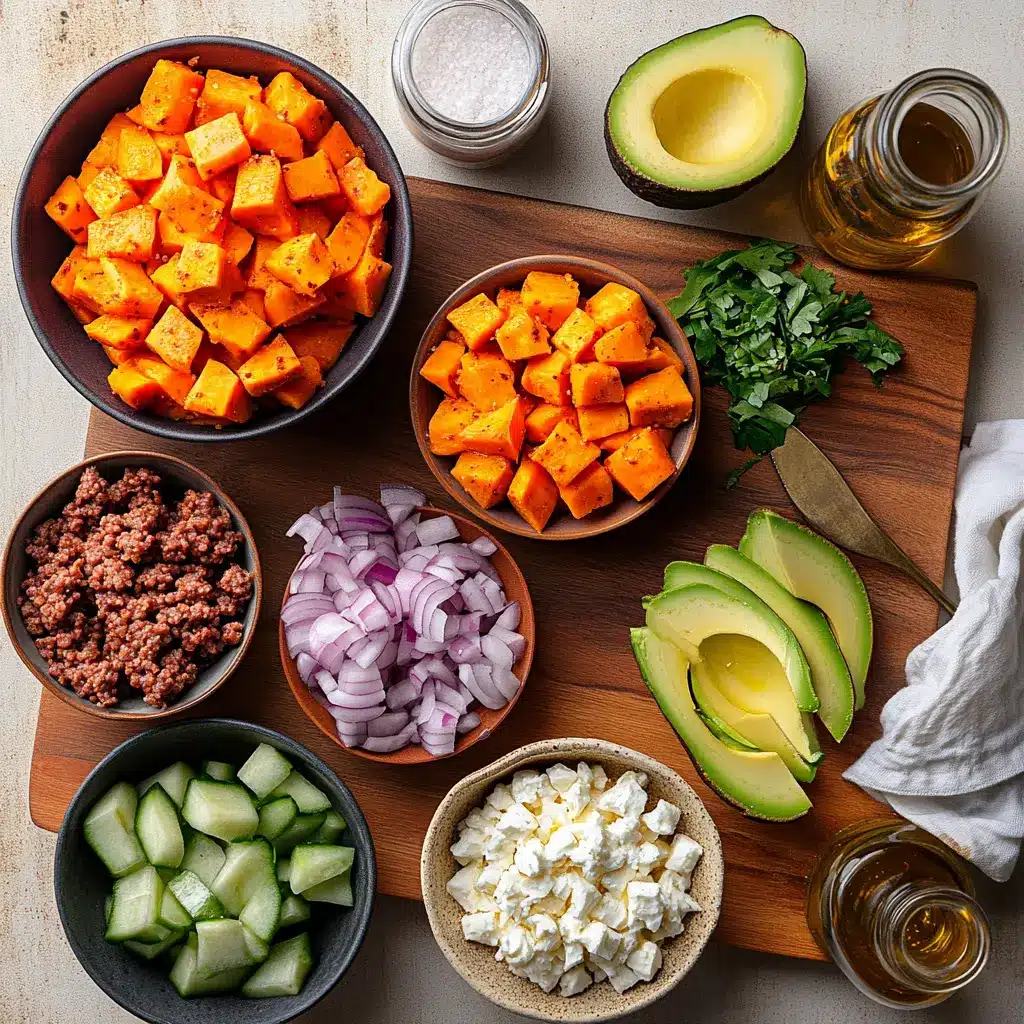 Ground Beef Hot Honey Bowl: Easy Delicious Dinner Idea 4 Ground beef hot honey bowl ingredients including roasted sweet potatoes, sliced avocado, crumbled white cheese, and taco-seasoned beef