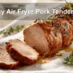 Juicy Air Fryer Pork Tenderloin Recipe: Ultimate Guide 6 Juicy Air Fryer Pork Tenderloin on white napkin with glass of water, warm natural light