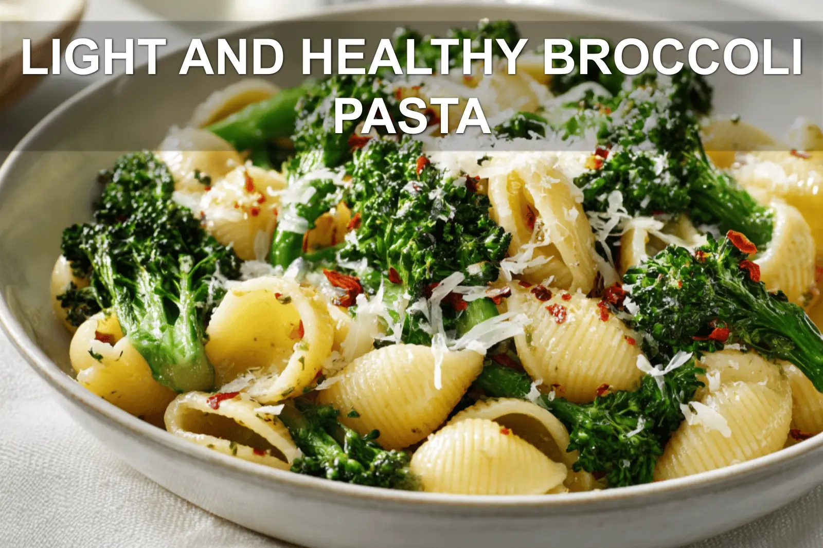 LIGHT AND HEALTHY BROCCOLI PASTA plated with broccoli florets garlic and grated cheese warm natural light