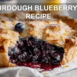 Sourdough Blueberry Pie Recipe: Irresistibly Fresh Delight 7 SOURDOUGH BLUEBERRY PIE RECIPE hero image warm natural light slice on white cloth