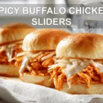 SPICY BUFFALO CHICKEN SLIDERS on slider buns with buffalo sauce melted cheese garlic butter