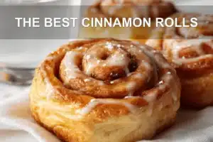 The Best Cinnamon Rolls: Easy and Irresistible Recipe THE BEST CINNAMON ROLLS warm glazed pastries on white cloth with glass of water