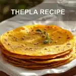 THEPLA RECIPE warm golden thepla stack on white napkin with sesame and fenugreek leaves