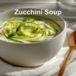 Zucchini Soup: Easy and Delicious Recipes 6 Zucchini Soup garnished with dill in white bowl on cloth beside clear water glass