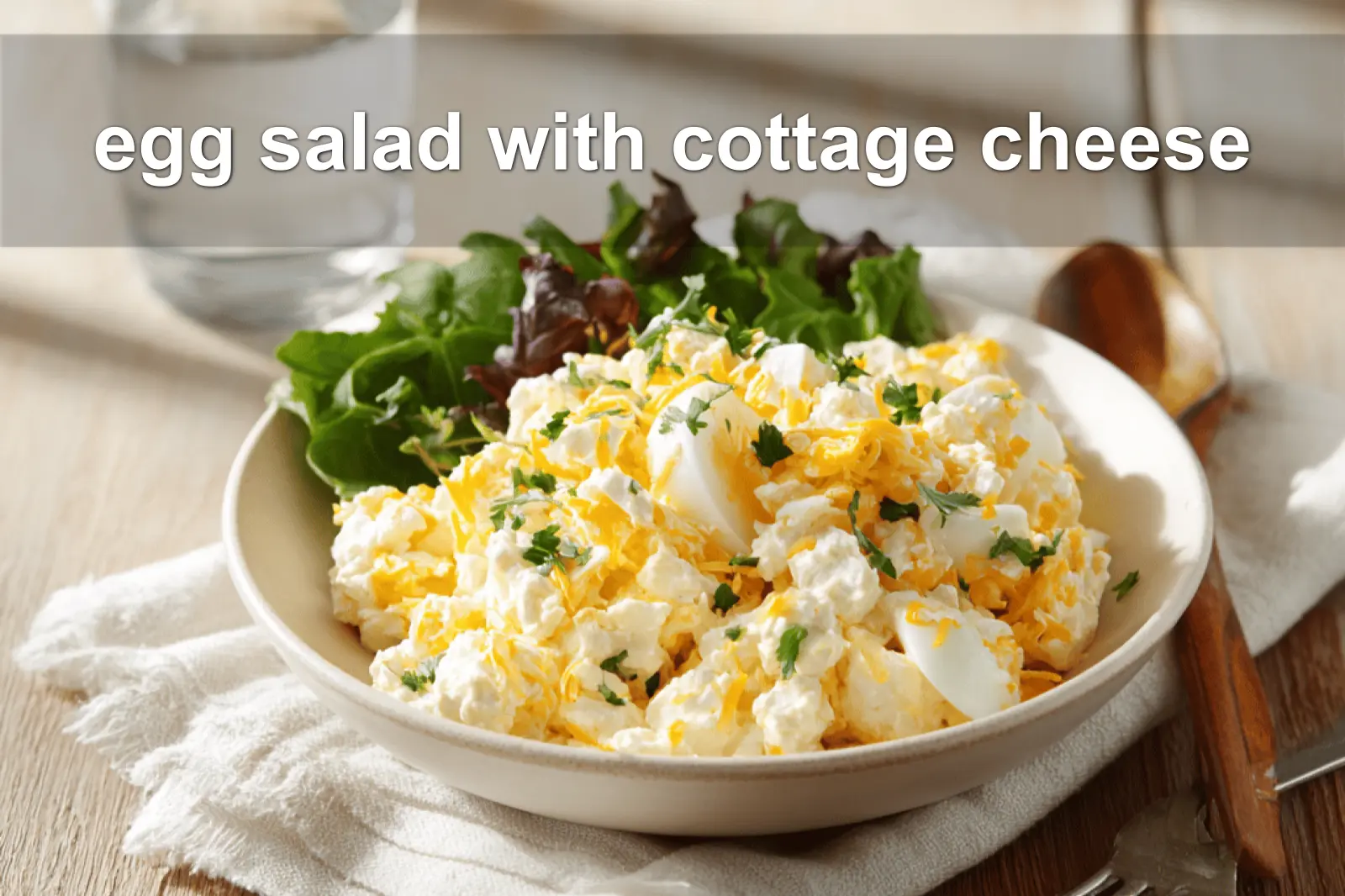Egg salad with cottage cheese on white napkin, vibrant peppers and herbs, water glass
